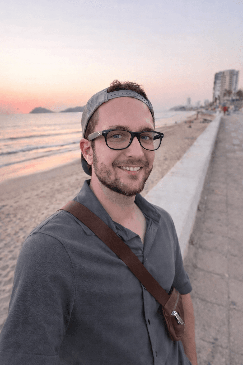 Founder portrait of the KH AI founder on a beach at sunset